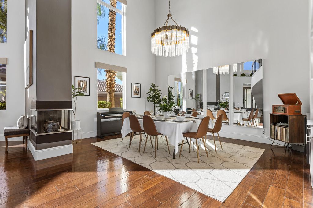 2000 Bogart Court, Las Vegas, Nevada is a one of a kind home situated on a cul-de-sac inside a private gated community featuring stunning finishes throughout with Limestone and hardwood flooring, quartzite fireplace, motorized window shades and grand 24” foot ceilings.