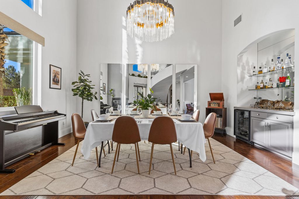 2000 Bogart Court, Las Vegas, Nevada is a one of a kind home situated on a cul-de-sac inside a private gated community featuring stunning finishes throughout with Limestone and hardwood flooring, quartzite fireplace, motorized window shades and grand 24” foot ceilings.