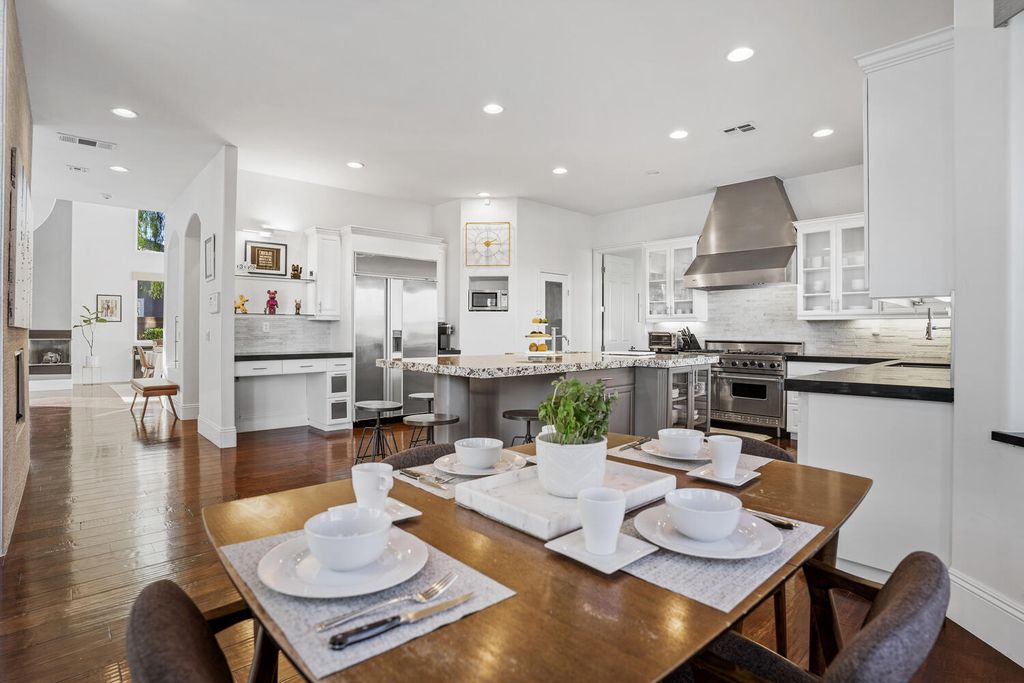 2000 Bogart Court, Las Vegas, Nevada is a one of a kind home situated on a cul-de-sac inside a private gated community featuring stunning finishes throughout with Limestone and hardwood flooring, quartzite fireplace, motorized window shades and grand 24” foot ceilings.