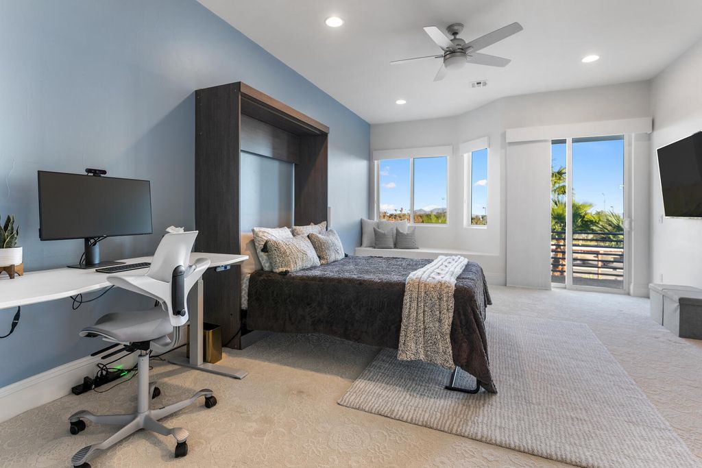 2000 Bogart Court, Las Vegas, Nevada is a one of a kind home situated on a cul-de-sac inside a private gated community featuring stunning finishes throughout with Limestone and hardwood flooring, quartzite fireplace, motorized window shades and grand 24” foot ceilings.