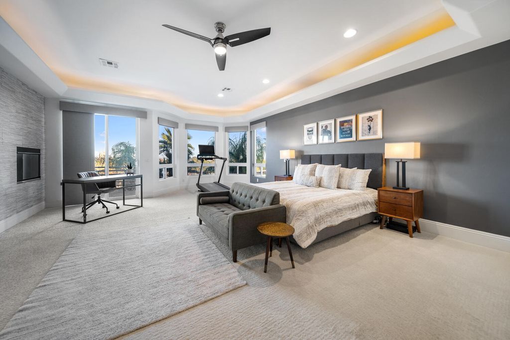 2000 Bogart Court, Las Vegas, Nevada is a one of a kind home situated on a cul-de-sac inside a private gated community featuring stunning finishes throughout with Limestone and hardwood flooring, quartzite fireplace, motorized window shades and grand 24” foot ceilings.