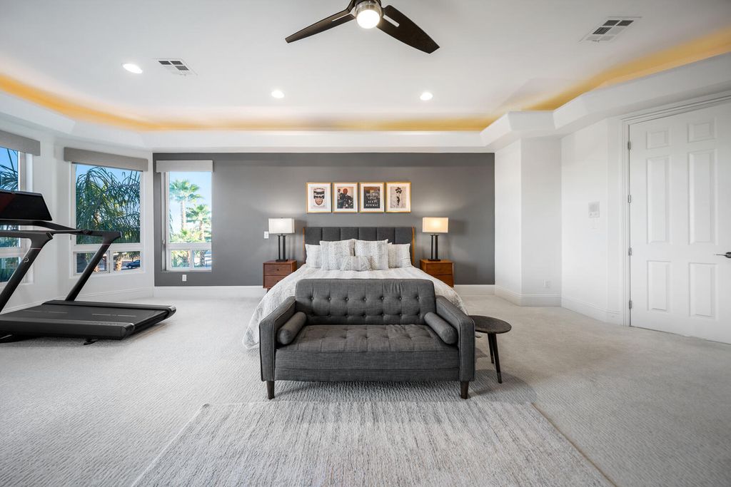 2000 Bogart Court, Las Vegas, Nevada is a one of a kind home situated on a cul-de-sac inside a private gated community featuring stunning finishes throughout with Limestone and hardwood flooring, quartzite fireplace, motorized window shades and grand 24” foot ceilings.