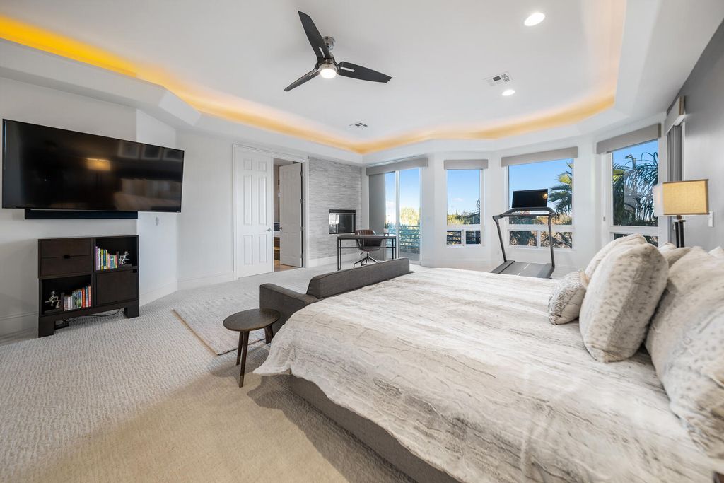 2000 Bogart Court, Las Vegas, Nevada is a one of a kind home situated on a cul-de-sac inside a private gated community featuring stunning finishes throughout with Limestone and hardwood flooring, quartzite fireplace, motorized window shades and grand 24” foot ceilings.