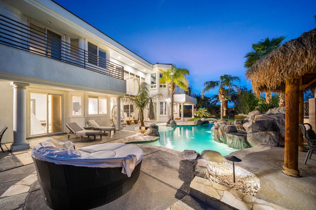 2000 Bogart Court, Las Vegas, Nevada is a one of a kind home situated on a cul-de-sac inside a private gated community featuring stunning finishes throughout with Limestone and hardwood flooring, quartzite fireplace, motorized window shades and grand 24” foot ceilings.