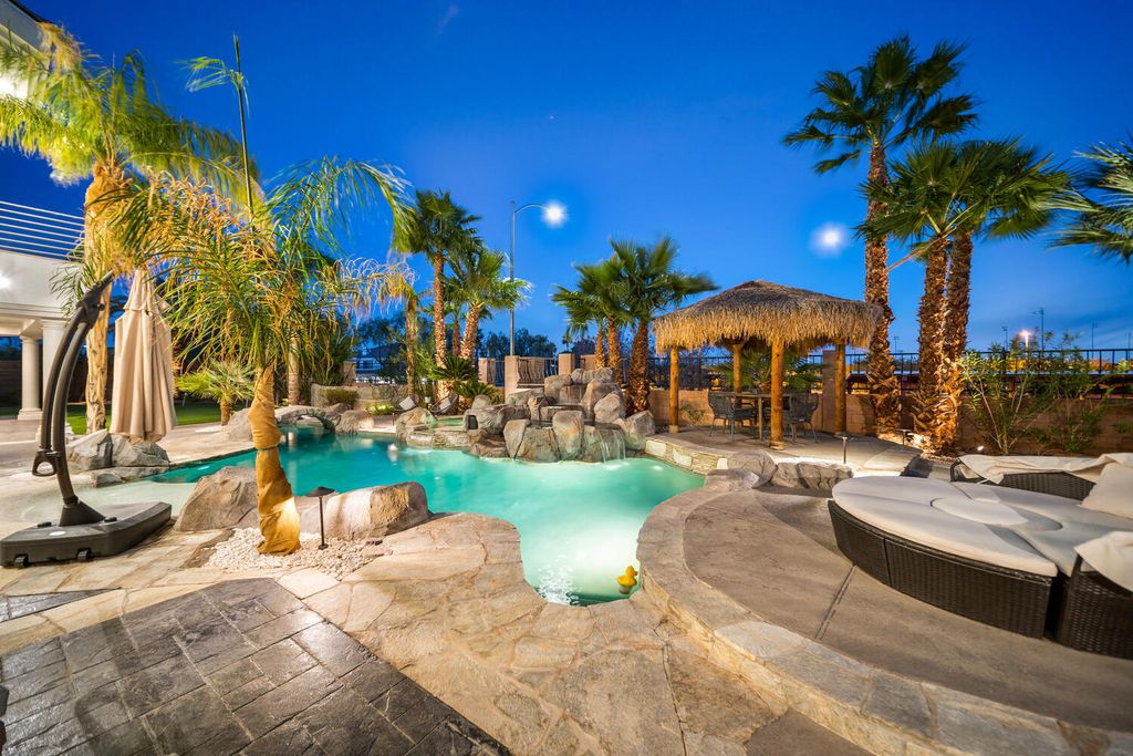 2000 Bogart Court, Las Vegas, Nevada is a one of a kind home situated on a cul-de-sac inside a private gated community featuring stunning finishes throughout with Limestone and hardwood flooring, quartzite fireplace, motorized window shades and grand 24” foot ceilings.