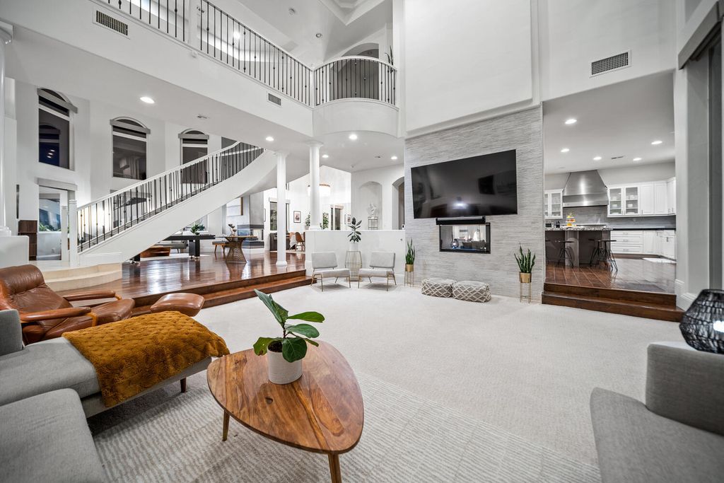 2000 Bogart Court, Las Vegas, Nevada is a one of a kind home situated on a cul-de-sac inside a private gated community featuring stunning finishes throughout with Limestone and hardwood flooring, quartzite fireplace, motorized window shades and grand 24” foot ceilings.