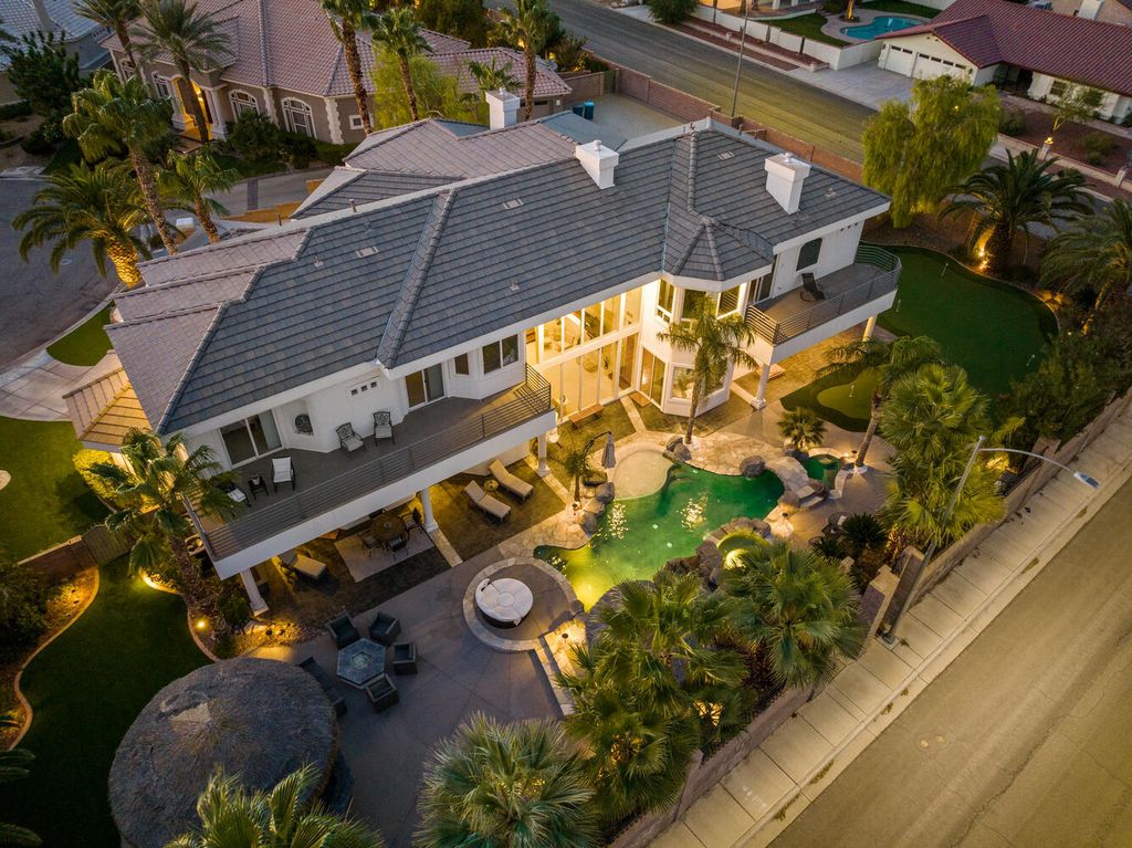 2000 Bogart Court, Las Vegas, Nevada is a one of a kind home situated on a cul-de-sac inside a private gated community featuring stunning finishes throughout with Limestone and hardwood flooring, quartzite fireplace, motorized window shades and grand 24” foot ceilings.