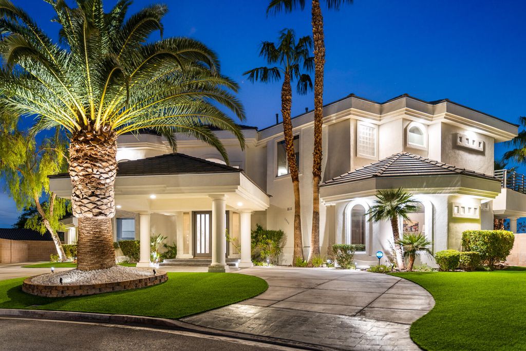 2000 Bogart Court, Las Vegas, Nevada is a one of a kind home situated on a cul-de-sac inside a private gated community featuring stunning finishes throughout with Limestone and hardwood flooring, quartzite fireplace, motorized window shades and grand 24” foot ceilings.
