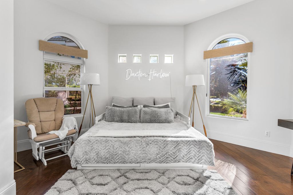 2000 Bogart Court, Las Vegas, Nevada is a one of a kind home situated on a cul-de-sac inside a private gated community featuring stunning finishes throughout with Limestone and hardwood flooring, quartzite fireplace, motorized window shades and grand 24” foot ceilings.