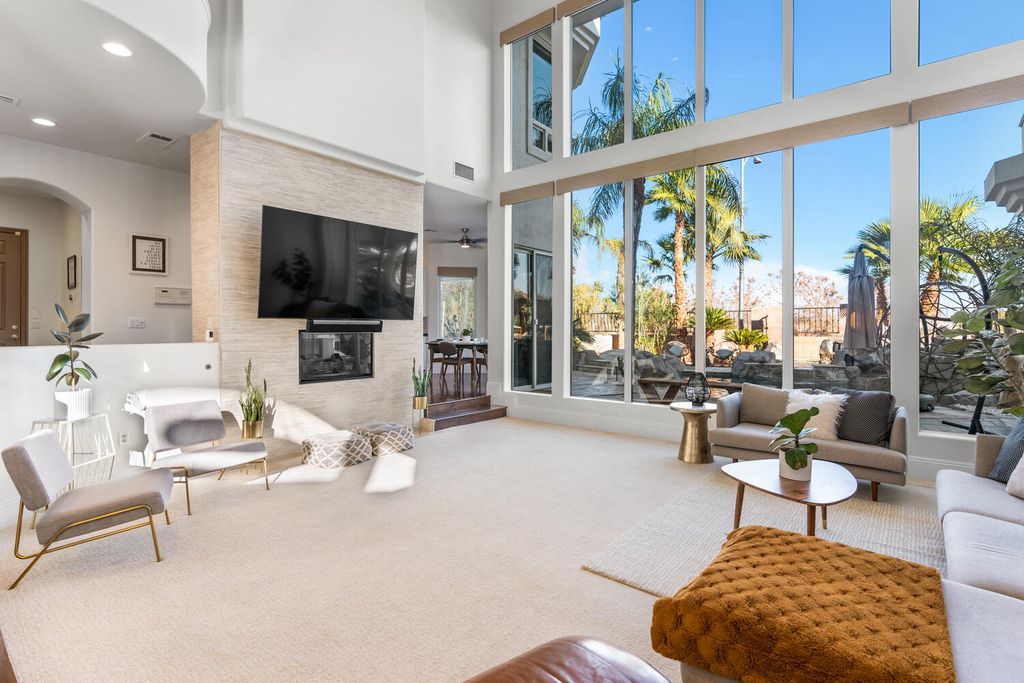 2000 Bogart Court, Las Vegas, Nevada is a one of a kind home situated on a cul-de-sac inside a private gated community featuring stunning finishes throughout with Limestone and hardwood flooring, quartzite fireplace, motorized window shades and grand 24” foot ceilings.