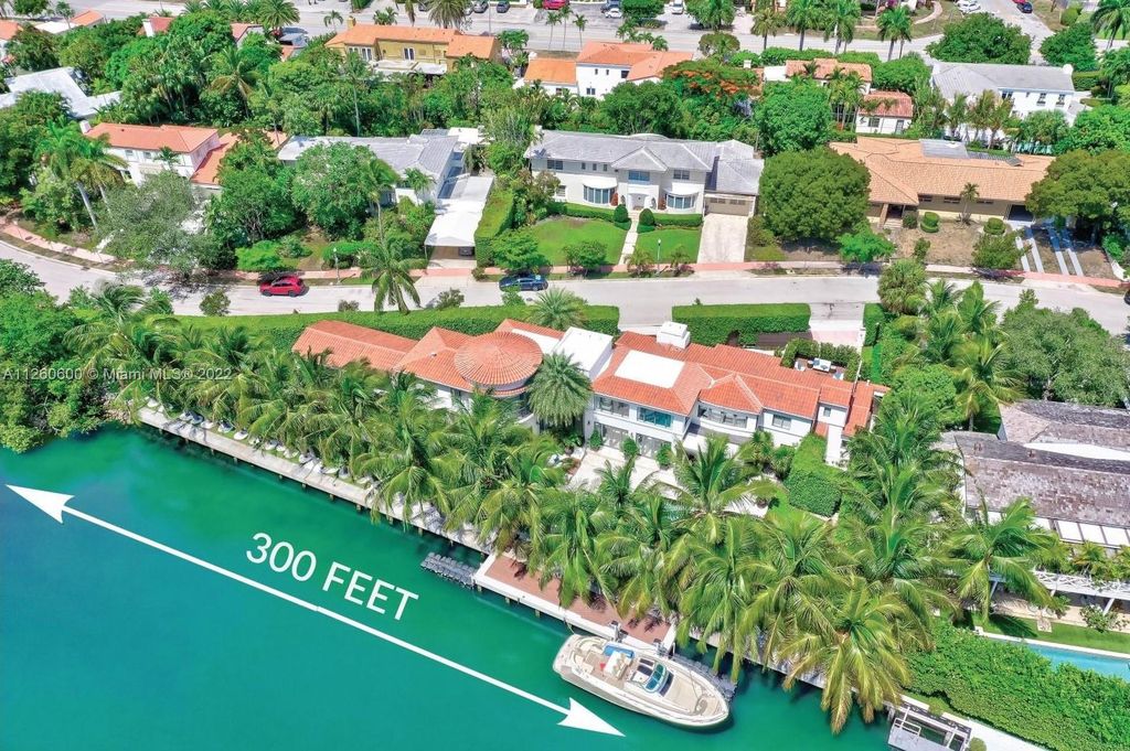 2901 Flamingo Drive, Miami Beach, Florida is named La Joya with 300 foot of water in most vibrant neighborhood on Miami Beach, features include dramatic master + sitting rm. 13ft ceilings, wall of glass, + 3 terraces. 4 beds up 1 down+ office/library. 1 bd, 1 and a half bath guest villa with private patio, 2 car garage, private gated entry court.