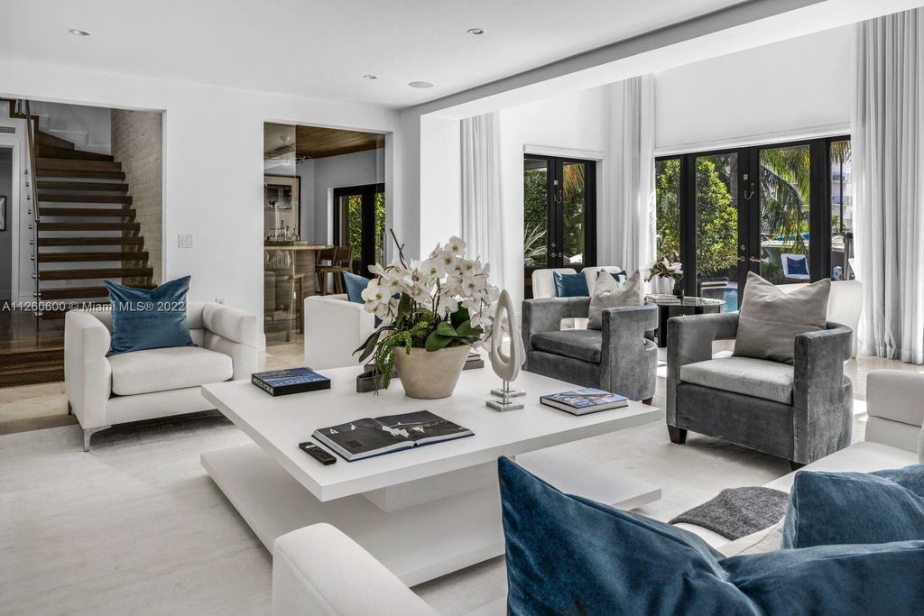 2901 Flamingo Drive, Miami Beach, Florida is named La Joya with 300 foot of water in most vibrant neighborhood on Miami Beach, features include dramatic master + sitting rm. 13ft ceilings, wall of glass, + 3 terraces. 4 beds up 1 down+ office/library. 1 bd, 1 and a half bath guest villa with private patio, 2 car garage, private gated entry court.