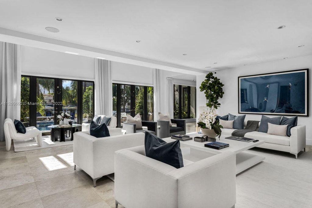 2901 Flamingo Drive, Miami Beach, Florida is named La Joya with 300 foot of water in most vibrant neighborhood on Miami Beach, features include dramatic master + sitting rm. 13ft ceilings, wall of glass, + 3 terraces. 4 beds up 1 down+ office/library. 1 bd, 1 and a half bath guest villa with private patio, 2 car garage, private gated entry court.
