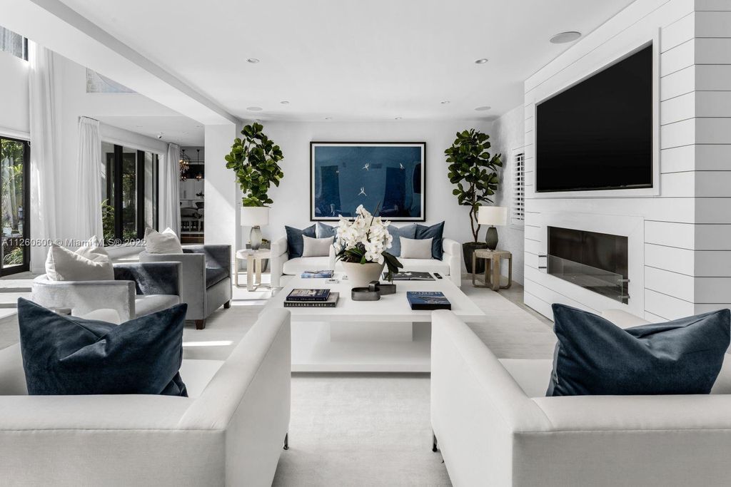 2901 Flamingo Drive, Miami Beach, Florida is named La Joya with 300 foot of water in most vibrant neighborhood on Miami Beach, features include dramatic master + sitting rm. 13ft ceilings, wall of glass, + 3 terraces. 4 beds up 1 down+ office/library. 1 bd, 1 and a half bath guest villa with private patio, 2 car garage, private gated entry court.