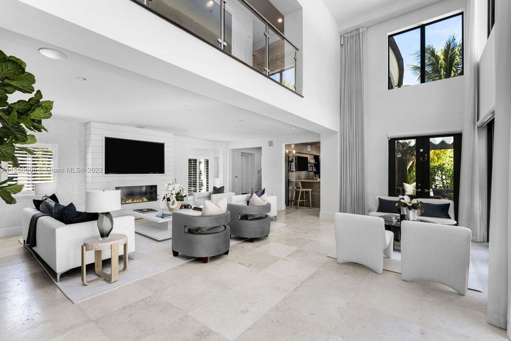 2901 Flamingo Drive, Miami Beach, Florida is named La Joya with 300 foot of water in most vibrant neighborhood on Miami Beach, features include dramatic master + sitting rm. 13ft ceilings, wall of glass, + 3 terraces. 4 beds up 1 down+ office/library. 1 bd, 1 and a half bath guest villa with private patio, 2 car garage, private gated entry court.