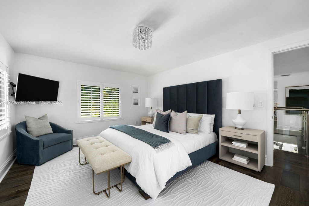 2901 Flamingo Drive, Miami Beach, Florida is named La Joya with 300 foot of water in most vibrant neighborhood on Miami Beach, features include dramatic master + sitting rm. 13ft ceilings, wall of glass, + 3 terraces. 4 beds up 1 down+ office/library. 1 bd, 1 and a half bath guest villa with private patio, 2 car garage, private gated entry court.