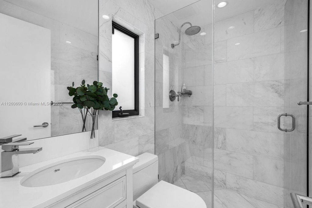 2901 Flamingo Drive, Miami Beach, Florida is named La Joya with 300 foot of water in most vibrant neighborhood on Miami Beach, features include dramatic master + sitting rm. 13ft ceilings, wall of glass, + 3 terraces. 4 beds up 1 down+ office/library. 1 bd, 1 and a half bath guest villa with private patio, 2 car garage, private gated entry court.