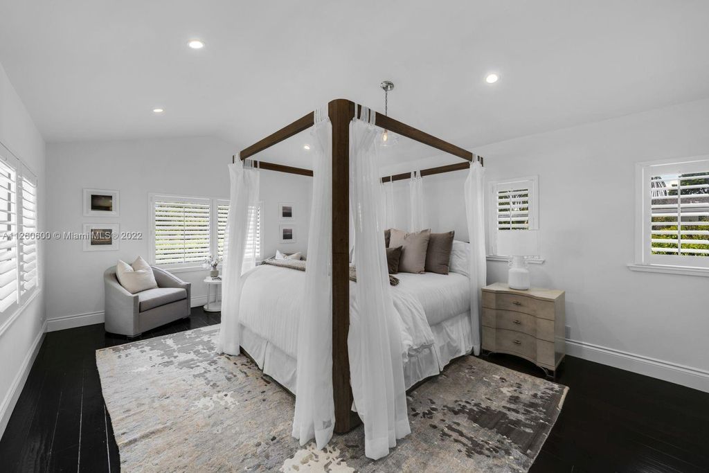 2901 Flamingo Drive, Miami Beach, Florida is named La Joya with 300 foot of water in most vibrant neighborhood on Miami Beach, features include dramatic master + sitting rm. 13ft ceilings, wall of glass, + 3 terraces. 4 beds up 1 down+ office/library. 1 bd, 1 and a half bath guest villa with private patio, 2 car garage, private gated entry court.