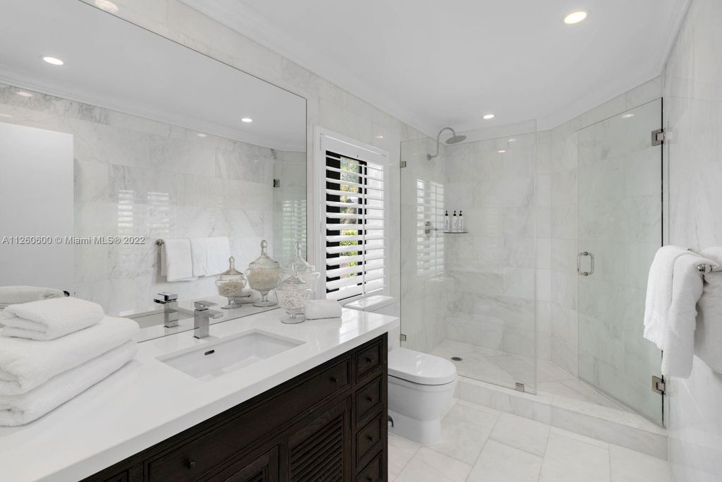 2901 Flamingo Drive, Miami Beach, Florida is named La Joya with 300 foot of water in most vibrant neighborhood on Miami Beach, features include dramatic master + sitting rm. 13ft ceilings, wall of glass, + 3 terraces. 4 beds up 1 down+ office/library. 1 bd, 1 and a half bath guest villa with private patio, 2 car garage, private gated entry court.