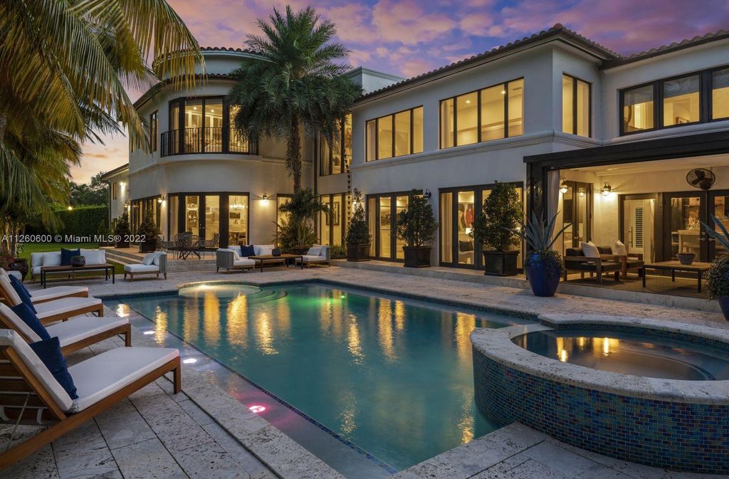 2901 Flamingo Drive, Miami Beach, Florida is named La Joya with 300 foot of water in most vibrant neighborhood on Miami Beach, features include dramatic master + sitting rm. 13ft ceilings, wall of glass, + 3 terraces. 4 beds up 1 down+ office/library. 1 bd, 1 and a half bath guest villa with private patio, 2 car garage, private gated entry court.
