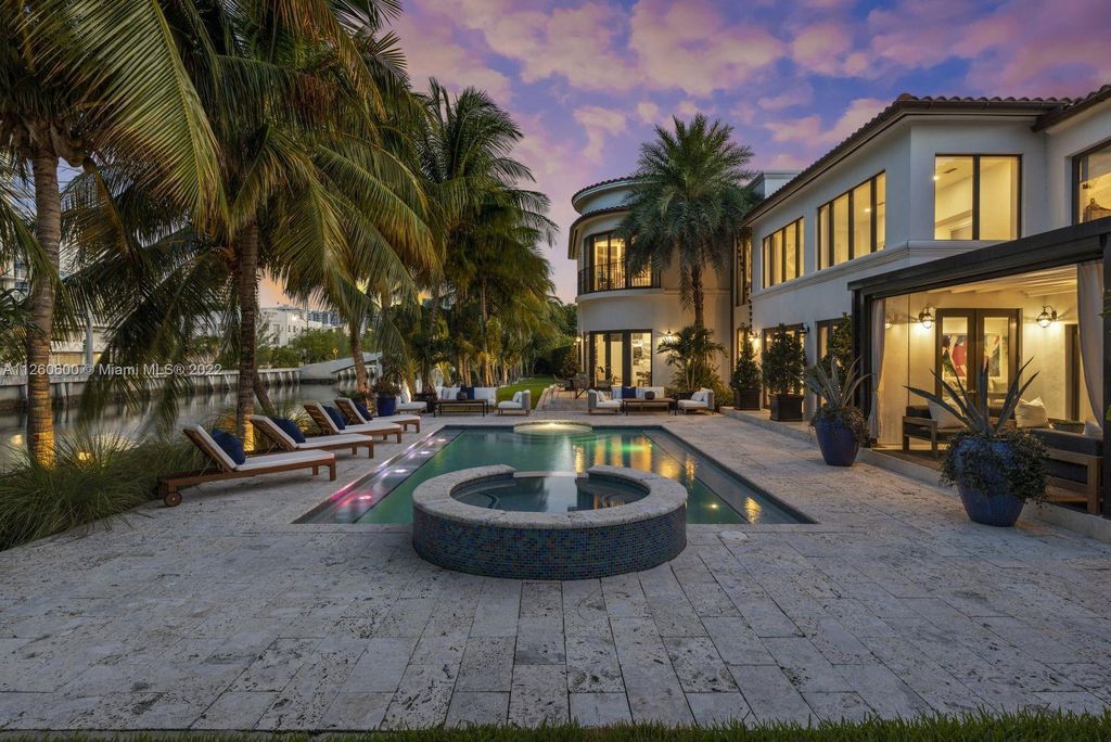 2901 Flamingo Drive, Miami Beach, Florida is named La Joya with 300 foot of water in most vibrant neighborhood on Miami Beach, features include dramatic master + sitting rm. 13ft ceilings, wall of glass, + 3 terraces. 4 beds up 1 down+ office/library. 1 bd, 1 and a half bath guest villa with private patio, 2 car garage, private gated entry court.