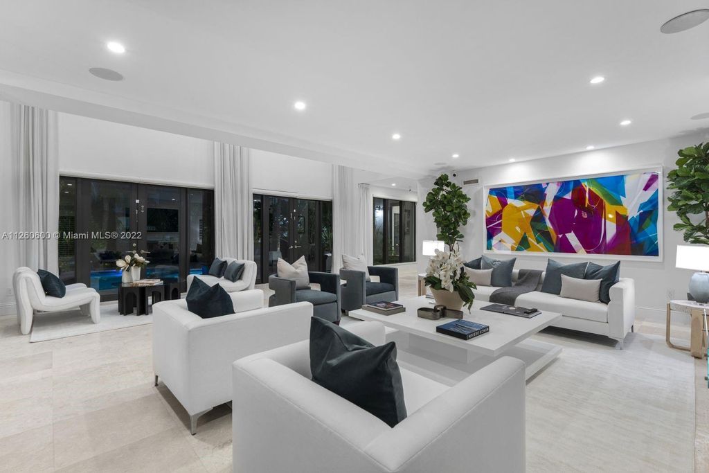 2901 Flamingo Drive, Miami Beach, Florida is named La Joya with 300 foot of water in most vibrant neighborhood on Miami Beach, features include dramatic master + sitting rm. 13ft ceilings, wall of glass, + 3 terraces. 4 beds up 1 down+ office/library. 1 bd, 1 and a half bath guest villa with private patio, 2 car garage, private gated entry court.