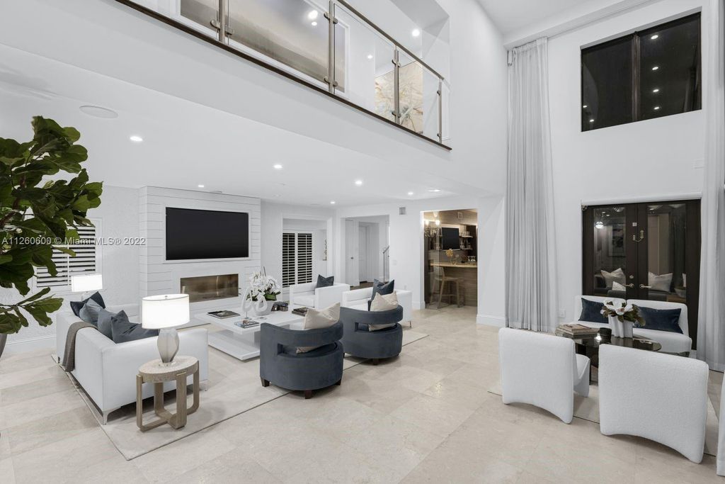 2901 Flamingo Drive, Miami Beach, Florida is named La Joya with 300 foot of water in most vibrant neighborhood on Miami Beach, features include dramatic master + sitting rm. 13ft ceilings, wall of glass, + 3 terraces. 4 beds up 1 down+ office/library. 1 bd, 1 and a half bath guest villa with private patio, 2 car garage, private gated entry court.
