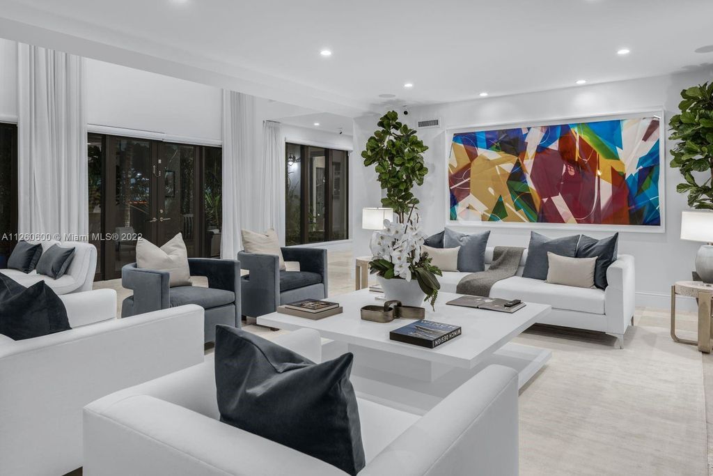 2901 Flamingo Drive, Miami Beach, Florida is named La Joya with 300 foot of water in most vibrant neighborhood on Miami Beach, features include dramatic master + sitting rm. 13ft ceilings, wall of glass, + 3 terraces. 4 beds up 1 down+ office/library. 1 bd, 1 and a half bath guest villa with private patio, 2 car garage, private gated entry court.