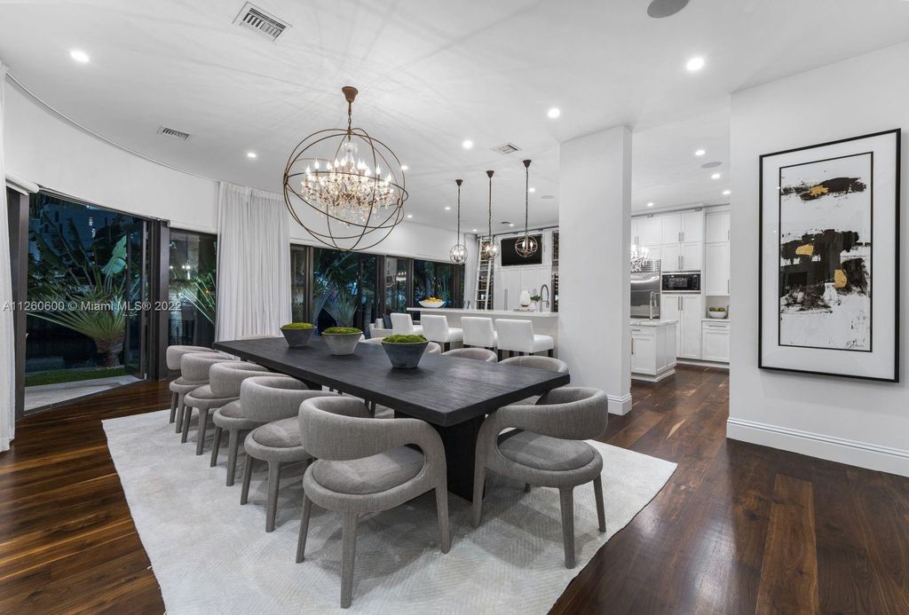 2901 Flamingo Drive, Miami Beach, Florida is named La Joya with 300 foot of water in most vibrant neighborhood on Miami Beach, features include dramatic master + sitting rm. 13ft ceilings, wall of glass, + 3 terraces. 4 beds up 1 down+ office/library. 1 bd, 1 and a half bath guest villa with private patio, 2 car garage, private gated entry court.