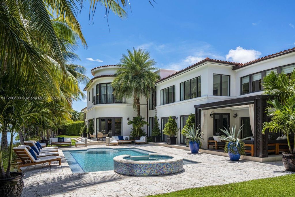2901 Flamingo Drive, Miami Beach, Florida is named La Joya with 300 foot of water in most vibrant neighborhood on Miami Beach, features include dramatic master + sitting rm. 13ft ceilings, wall of glass, + 3 terraces. 4 beds up 1 down+ office/library. 1 bd, 1 and a half bath guest villa with private patio, 2 car garage, private gated entry court.