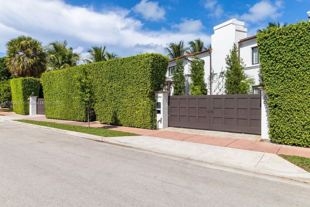 2901 Flamingo Drive, Miami Beach, Florida is named La Joya with 300 foot of water in most vibrant neighborhood on Miami Beach, features include dramatic master + sitting rm. 13ft ceilings, wall of glass, + 3 terraces. 4 beds up 1 down+ office/library. 1 bd, 1 and a half bath guest villa with private patio, 2 car garage, private gated entry court.