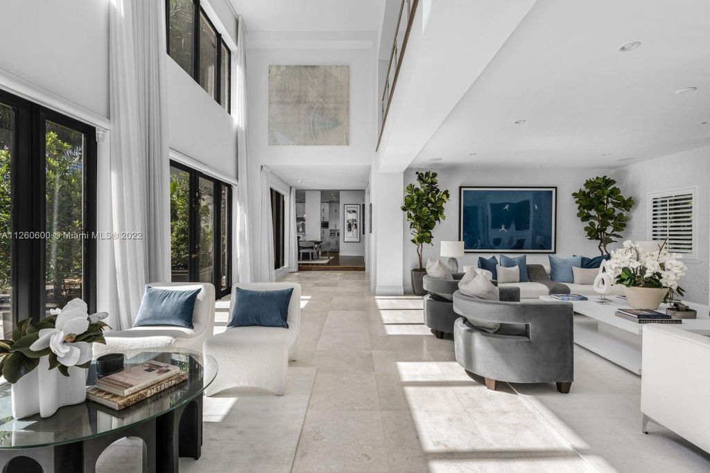 2901 Flamingo Drive, Miami Beach, Florida is named La Joya with 300 foot of water in most vibrant neighborhood on Miami Beach, features include dramatic master + sitting rm. 13ft ceilings, wall of glass, + 3 terraces. 4 beds up 1 down+ office/library. 1 bd, 1 and a half bath guest villa with private patio, 2 car garage, private gated entry court.