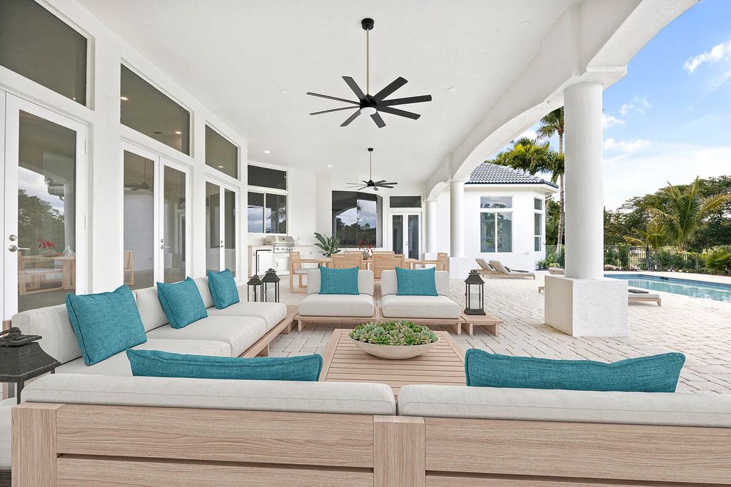 11795 Littlestone Court, Palm Beach Gardens, Florida is a stunning renovated one story house with golf views overlooking the PGA National Golf Course, filled with sunlight rooms, stylish welcoming spaces offering areas for intimate or grand-scale gatherings.