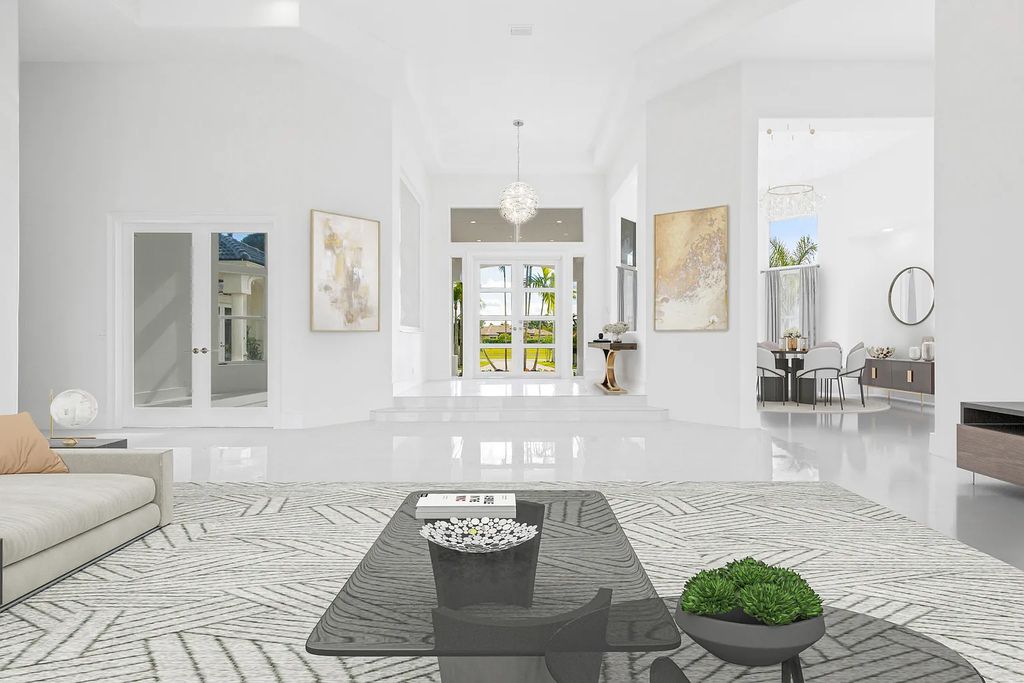 11795 Littlestone Court, Palm Beach Gardens, Florida is a stunning renovated one story house with golf views overlooking the PGA National Golf Course, filled with sunlight rooms, stylish welcoming spaces offering areas for intimate or grand-scale gatherings.