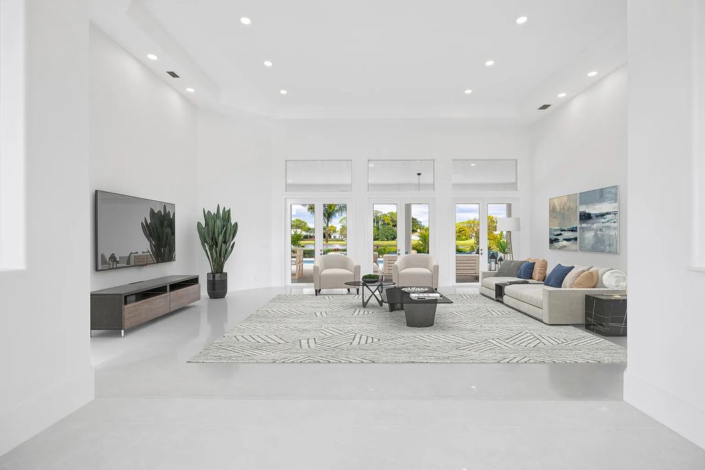 11795 Littlestone Court, Palm Beach Gardens, Florida is a stunning renovated one story house with golf views overlooking the PGA National Golf Course, filled with sunlight rooms, stylish welcoming spaces offering areas for intimate or grand-scale gatherings.