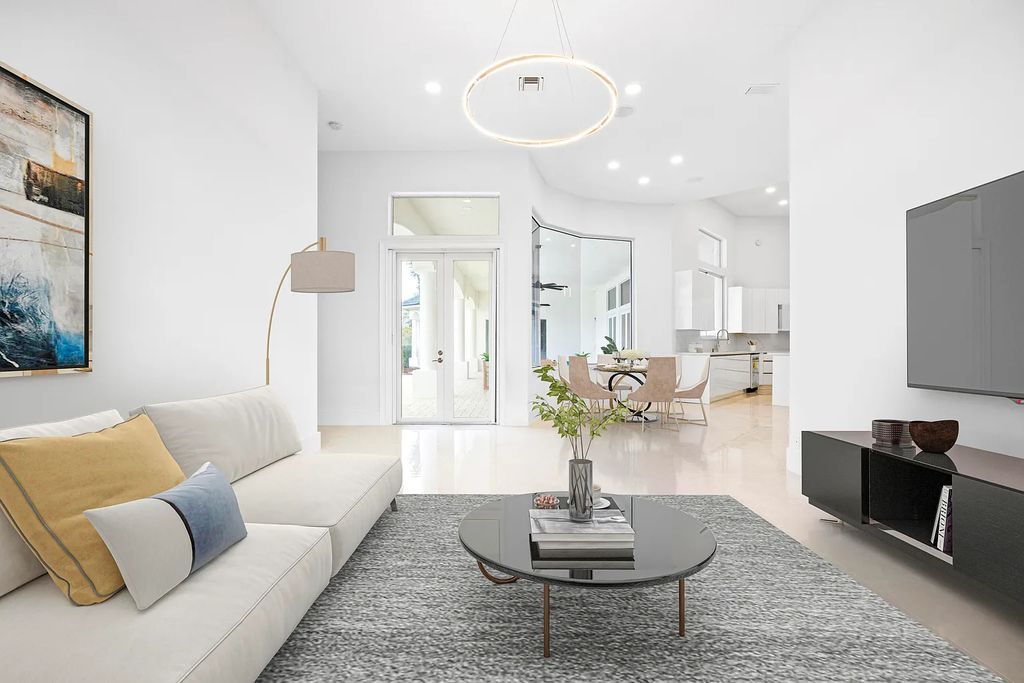 11795 Littlestone Court, Palm Beach Gardens, Florida is a stunning renovated one story house with golf views overlooking the PGA National Golf Course, filled with sunlight rooms, stylish welcoming spaces offering areas for intimate or grand-scale gatherings.