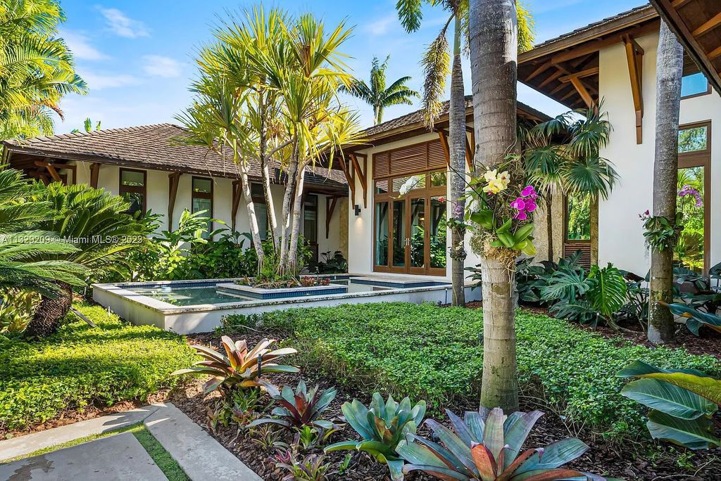 8601 Ponce De Leon Road, Miami, Florida, is ideal for family gatherings while providing ample indoor/outdoor spaces for a recreational and relaxing living experience.