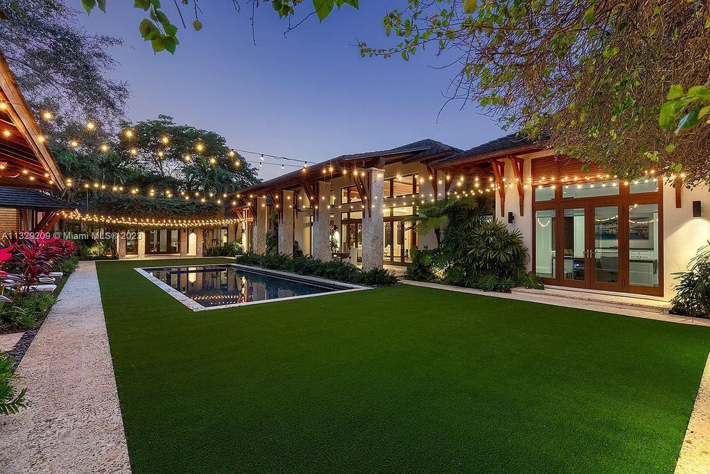 8601 Ponce De Leon Road, Miami, Florida, is ideal for family gatherings while providing ample indoor/outdoor spaces for a recreational and relaxing living experience.
