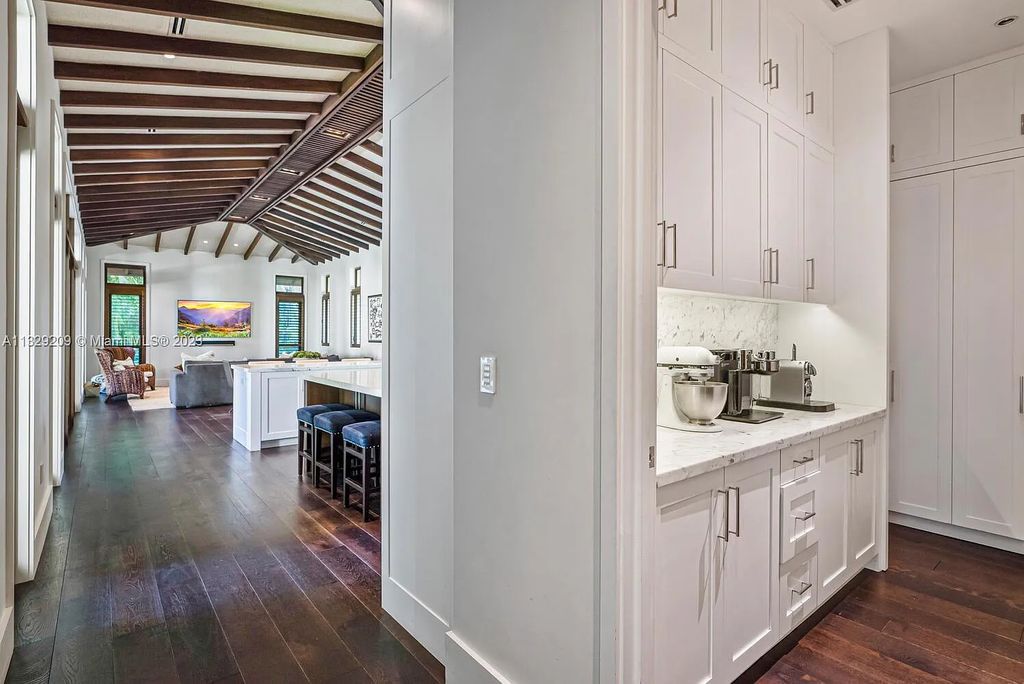8601 Ponce De Leon Road, Miami, Florida, is ideal for family gatherings while providing ample indoor/outdoor spaces for a recreational and relaxing living experience.