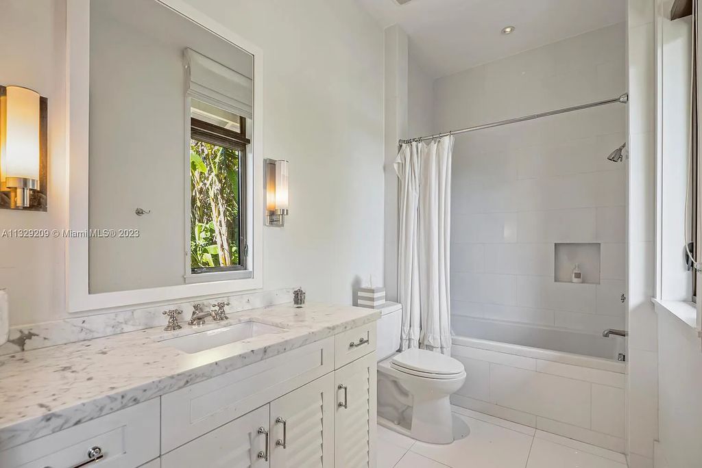 8601 Ponce De Leon Road, Miami, Florida, is ideal for family gatherings while providing ample indoor/outdoor spaces for a recreational and relaxing living experience.