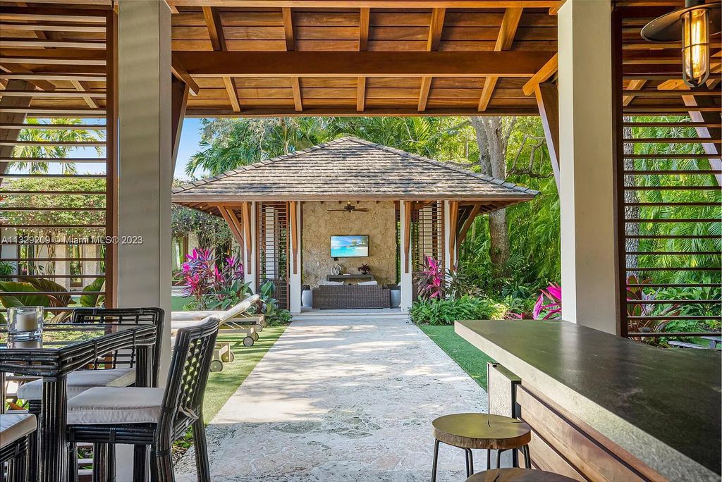 8601 Ponce De Leon Road, Miami, Florida, is ideal for family gatherings while providing ample indoor/outdoor spaces for a recreational and relaxing living experience.