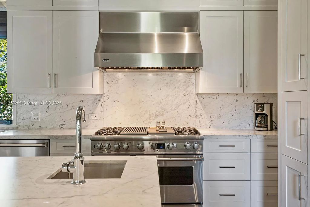 8601 Ponce De Leon Road, Miami, Florida, is ideal for family gatherings while providing ample indoor/outdoor spaces for a recreational and relaxing living experience.