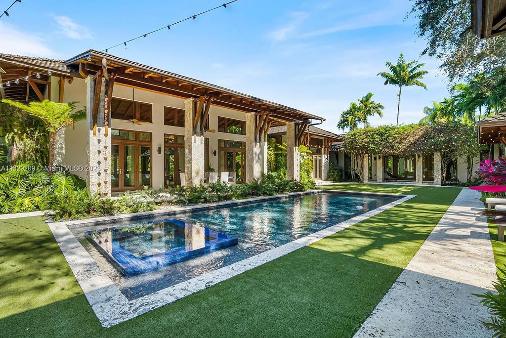 8601 Ponce De Leon Road, Miami, Florida, is ideal for family gatherings while providing ample indoor/outdoor spaces for a recreational and relaxing living experience.