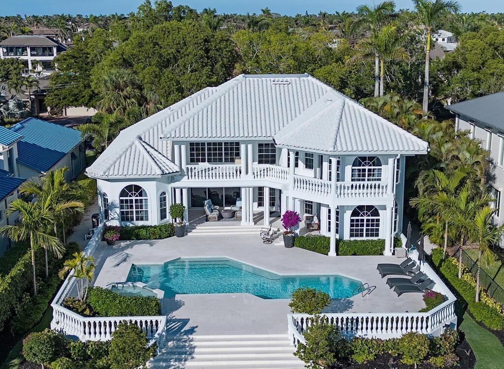 1947 8th Street South, Naples, Florida is spectacular residence on a unique location in the heart of Downtown capturing unparalleled views down Naples Bay towards Gordons Pass.