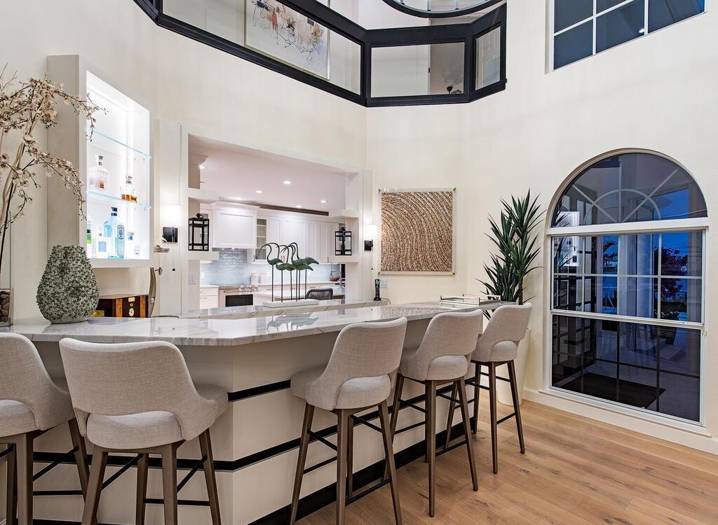 1947 8th Street South, Naples, Florida is spectacular residence on a unique location in the heart of Downtown capturing unparalleled views down Naples Bay towards Gordons Pass.