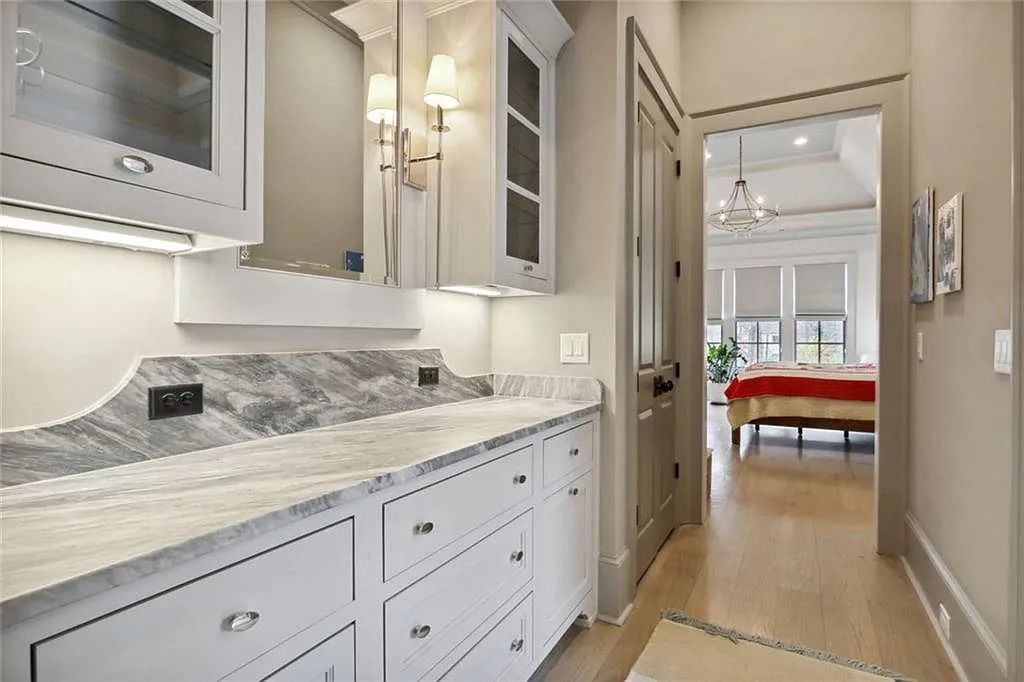 The Estate in Sandy Springs is a luxurious home showcasing magnificent garden area and perfect outdoor living area now available for sale. This home located at 4922 Powers Ferry Rd, Sandy Springs, Georgia; offering 05 bedrooms and 07 bathrooms with 6,515 square feet of living spaces. 