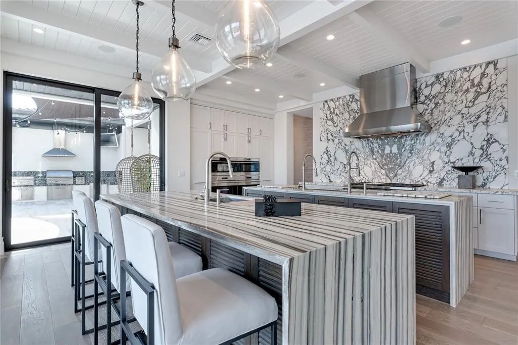 3799 Flamingo Avenue, Sarasota, Florida is an island paradise and strategically located to provide quick access to Sarasota’s shopping, dining, and world-renowned attractions, designed for entertaining and a relaxed island lifestyle. 