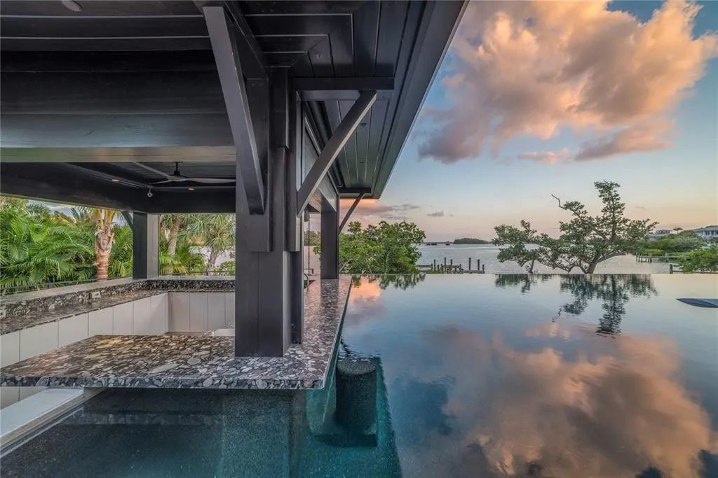 3799 Flamingo Avenue, Sarasota, Florida is an island paradise and strategically located to provide quick access to Sarasota’s shopping, dining, and world-renowned attractions, designed for entertaining and a relaxed island lifestyle. 