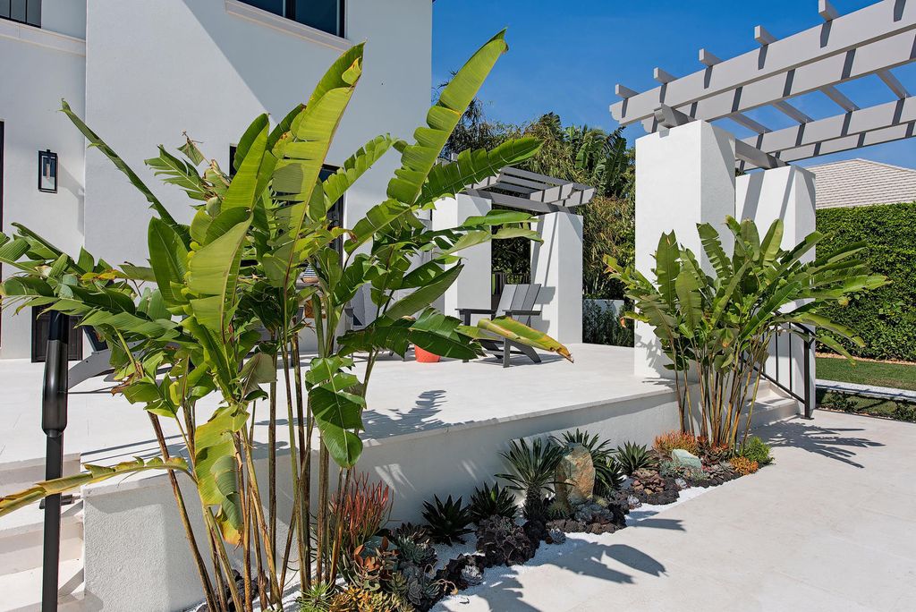 3595 Gin Lane, Naples, Florida is a gated property situated on nearly an acre overlooking Hidden Bay with quick access to the Gulf of Mexico, beautifully renovated and reimagined in 2018 with amenities as a private elevator, cherry wood library, double island in kitchen. 