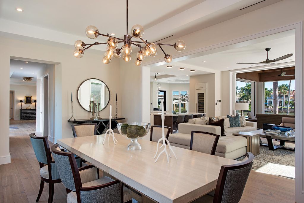 3595 Gin Lane, Naples, Florida is a gated property situated on nearly an acre overlooking Hidden Bay with quick access to the Gulf of Mexico, beautifully renovated and reimagined in 2018 with amenities as a private elevator, cherry wood library, double island in kitchen. 
